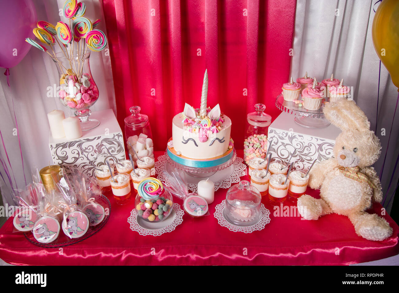 Sweet table and big unicorn cake for baby girl first birthday ...