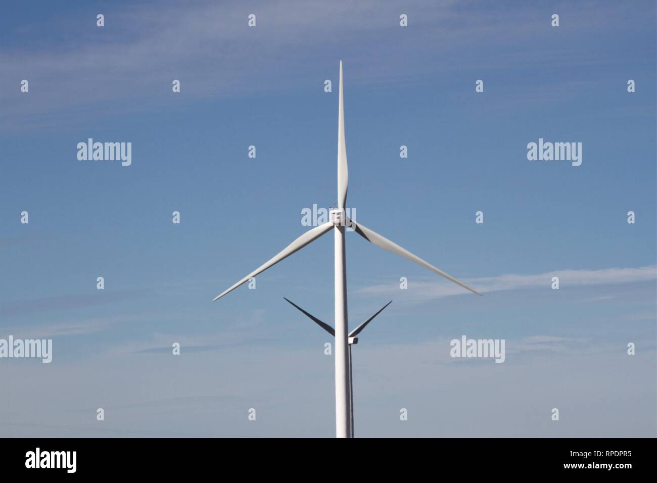 Wind turbines against a blue sky Stock Photo - Alamy