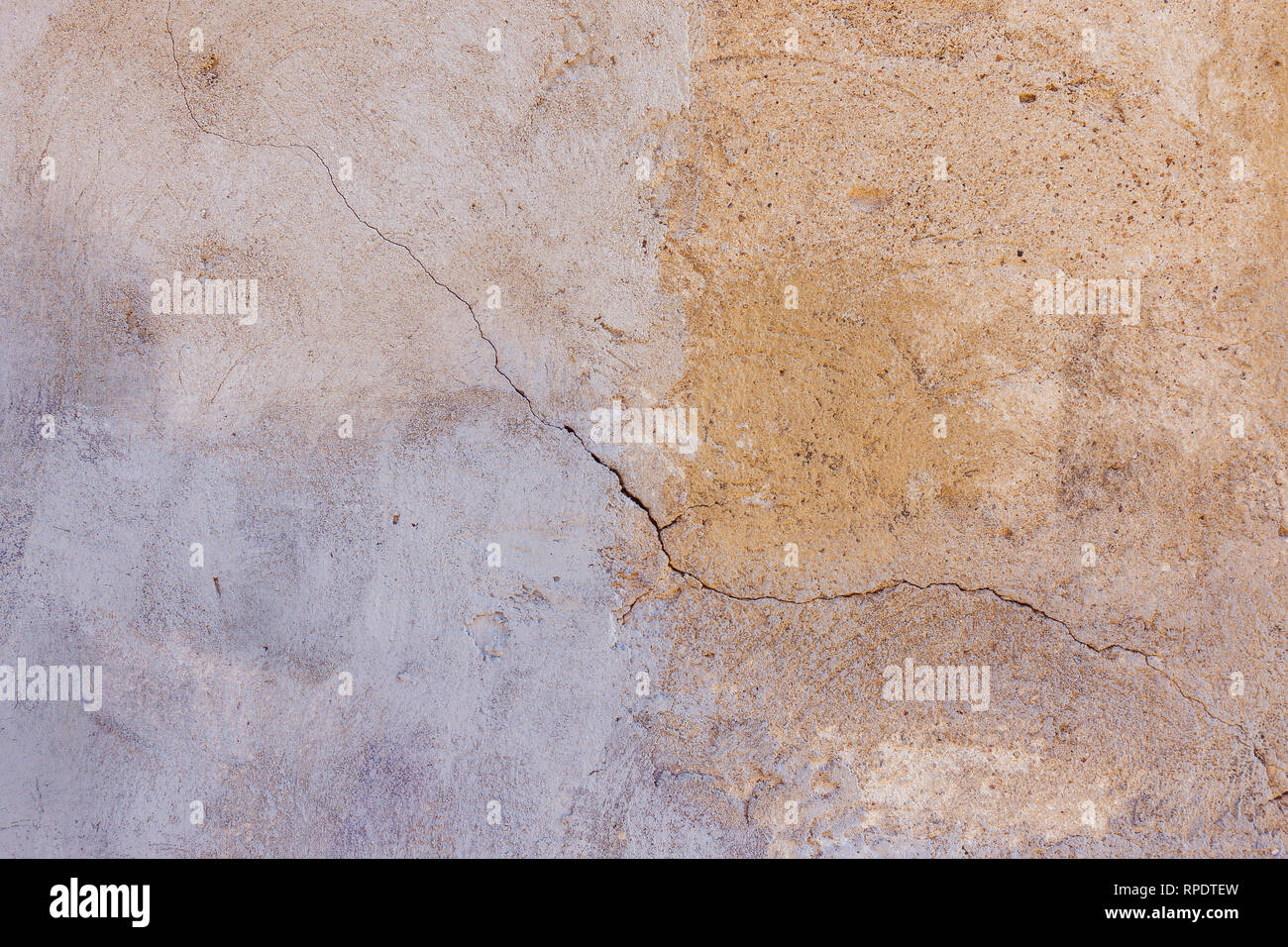 Old plastered painted in two colors wall texture background Stock Photo