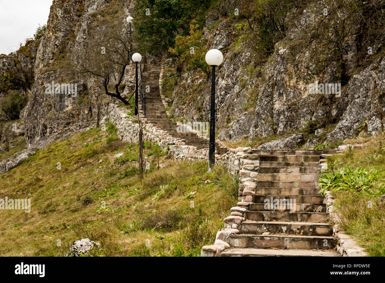 Stairs that leading to the cave where the  church of St. Peter and Paul is located. It was built in 13th century, in the village of Rsovci Stock Photo