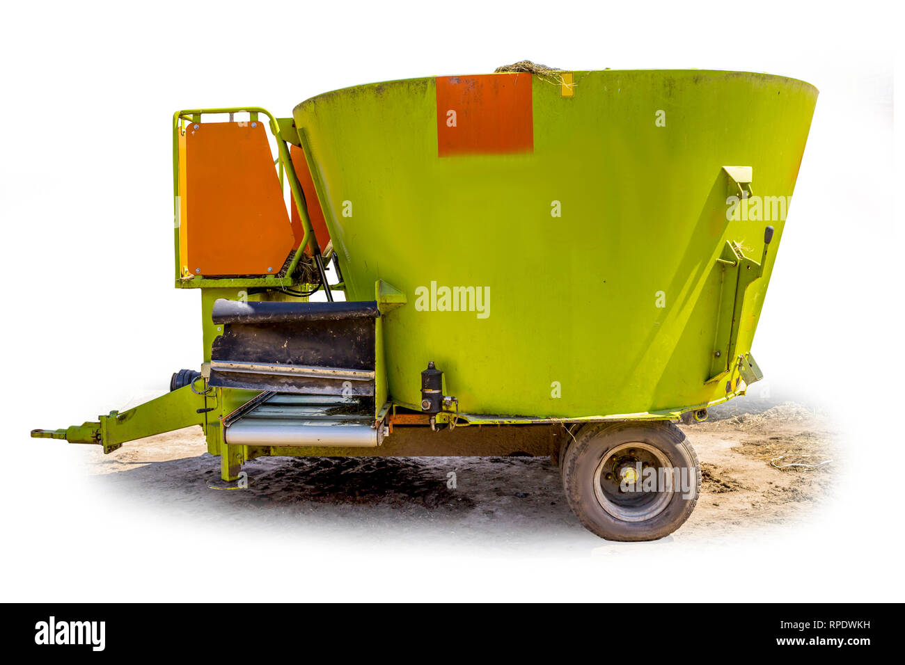 Tractor òrailer for mixing and distribution of feed for cows. Side view