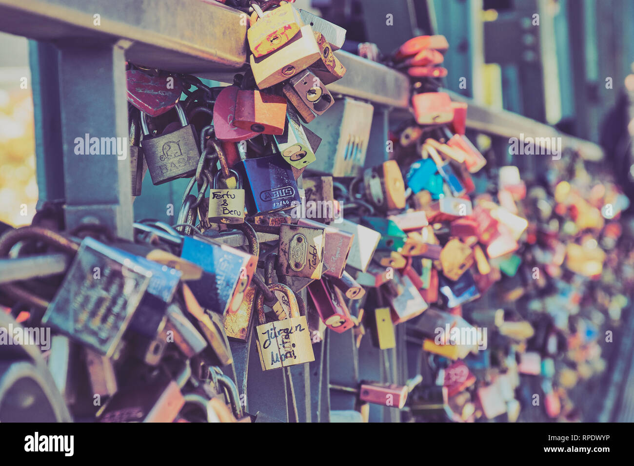 Frankfurt, Germany - September 30, 2018: Famous Eiserner Steg bridge with a lot of colored lovelocks in the City of Frankfurt am Main. Stock Photo