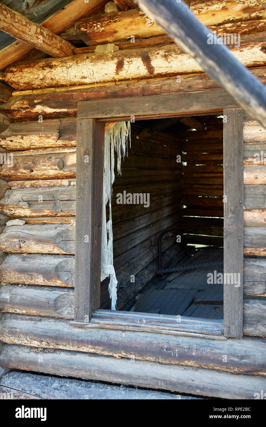 Decaying Curtain Hanging In A Window Of The Honeymoon Cabin In The