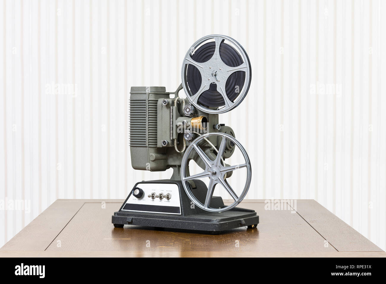 Antique 8mm home movie projector on wood table Stock Photo - Alamy