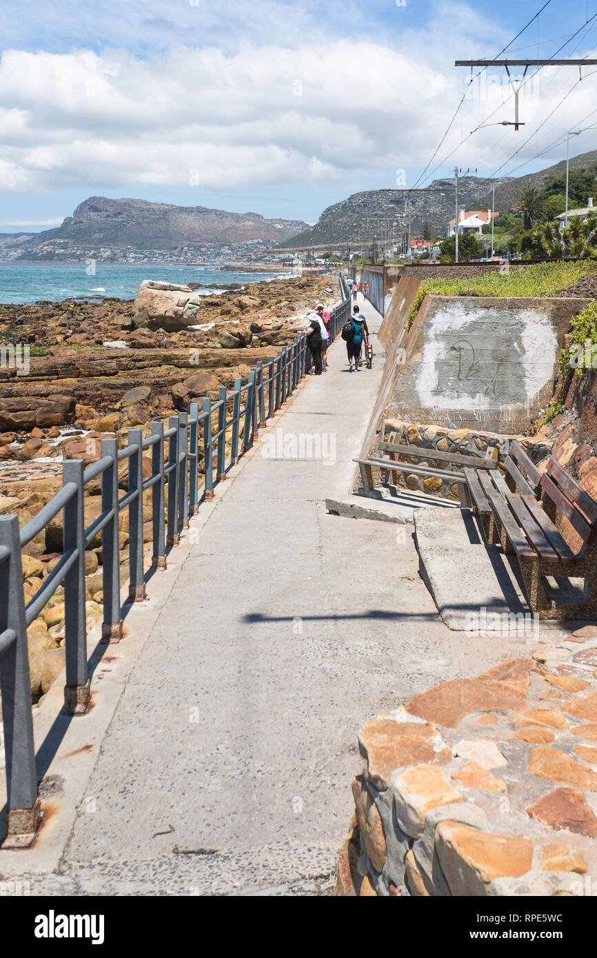 Coastal footpath running from Muizenberg to St James following the rocky coastline of False Bay in Cape Peninsula, South Africa Stock Photo