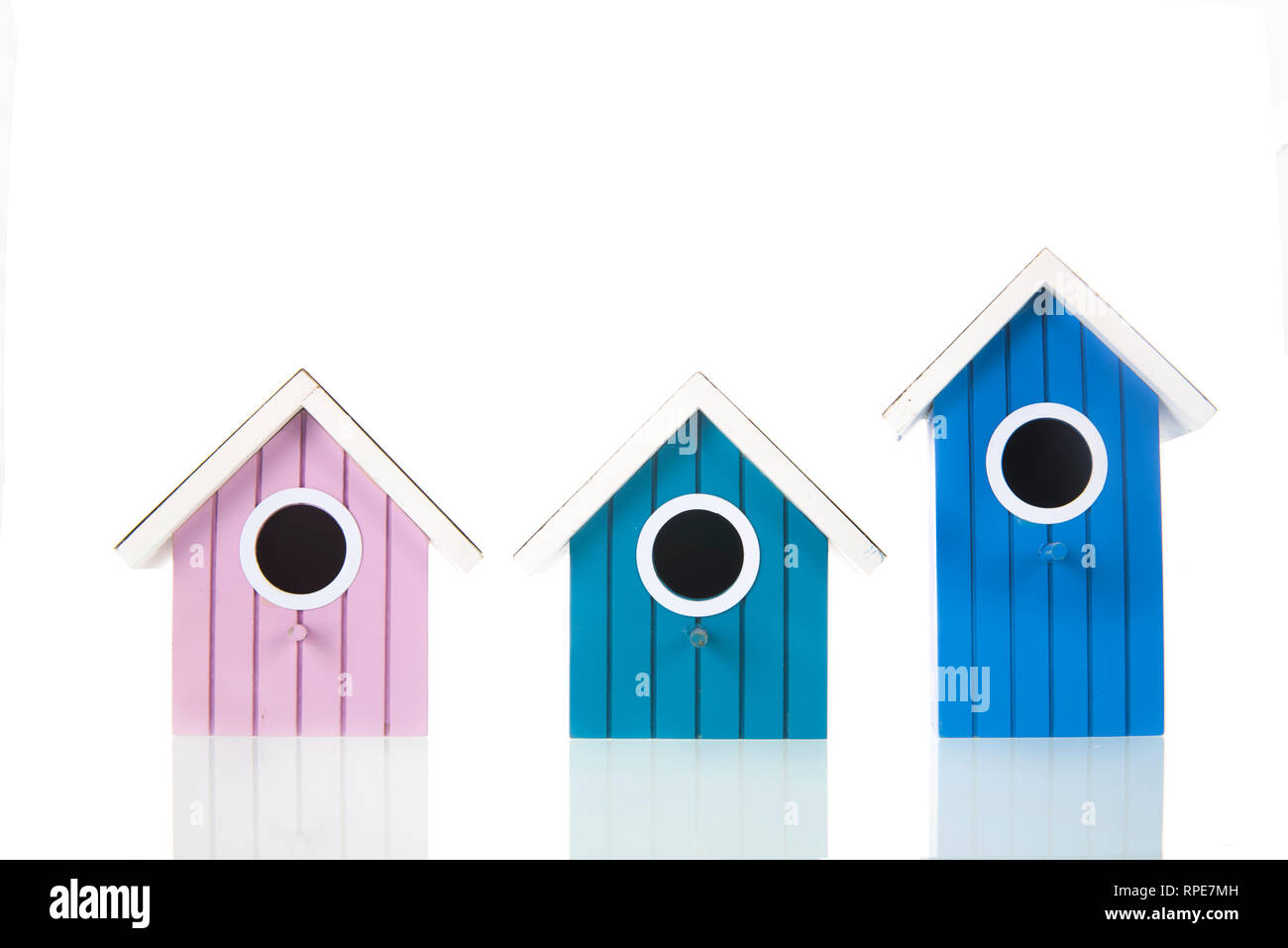 Many colorful bird boxes isolated over white background Stock Photo