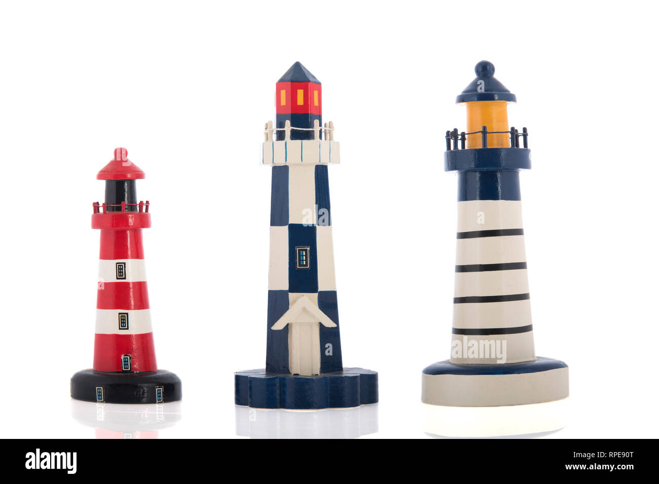 Miniature lighthouses isolated over white background Stock Photo - Alamy