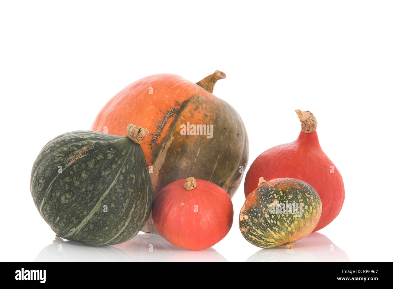 Orange and green pumpkins isolated over white background Stock Photo ...