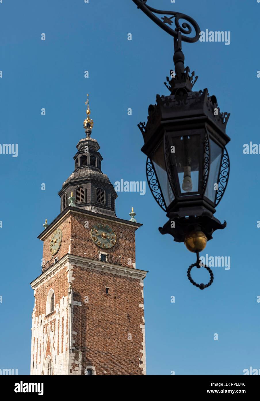 Street Light and Town Hall Tower on Main Market Square, Rynek Glowny, in Krakow, Poland Stock Photo