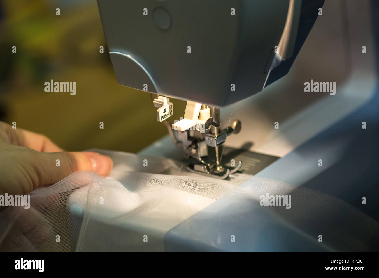 close up mechanism of sewing machine foot with needle and thread Stock ...