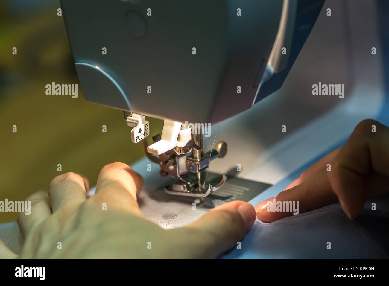 close up mechanism of sewing machine foot with needle and thread Stock ...