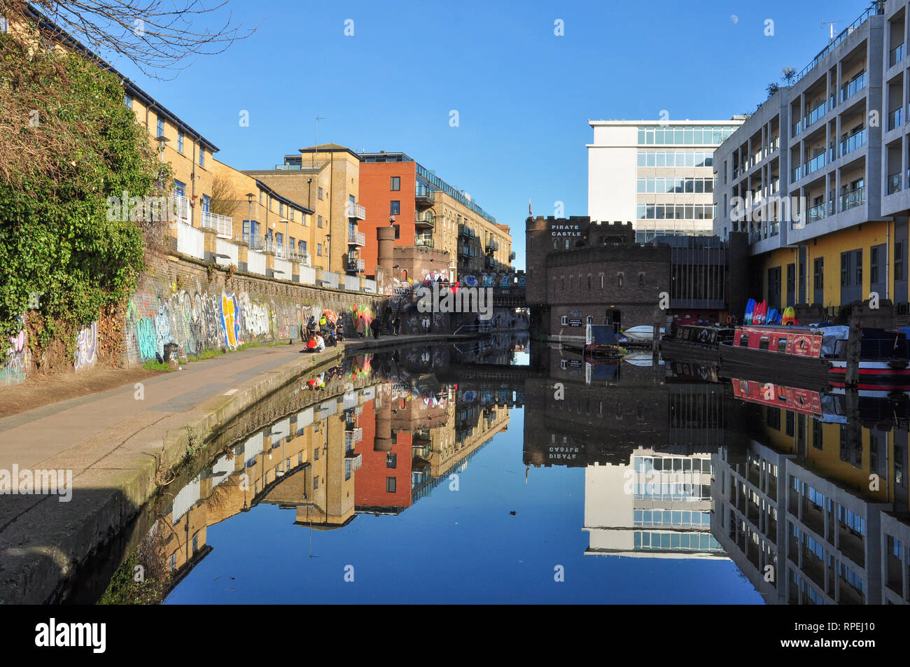 Tow path and Buildings reflected in Regent's Canal, Camden Town, London, England, UK Stock Photo