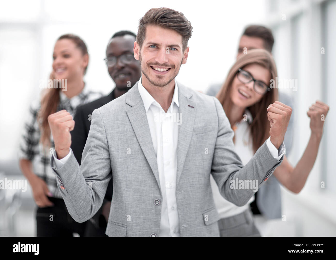 young people standing in the office and smiling Stock Photo - Alamy
