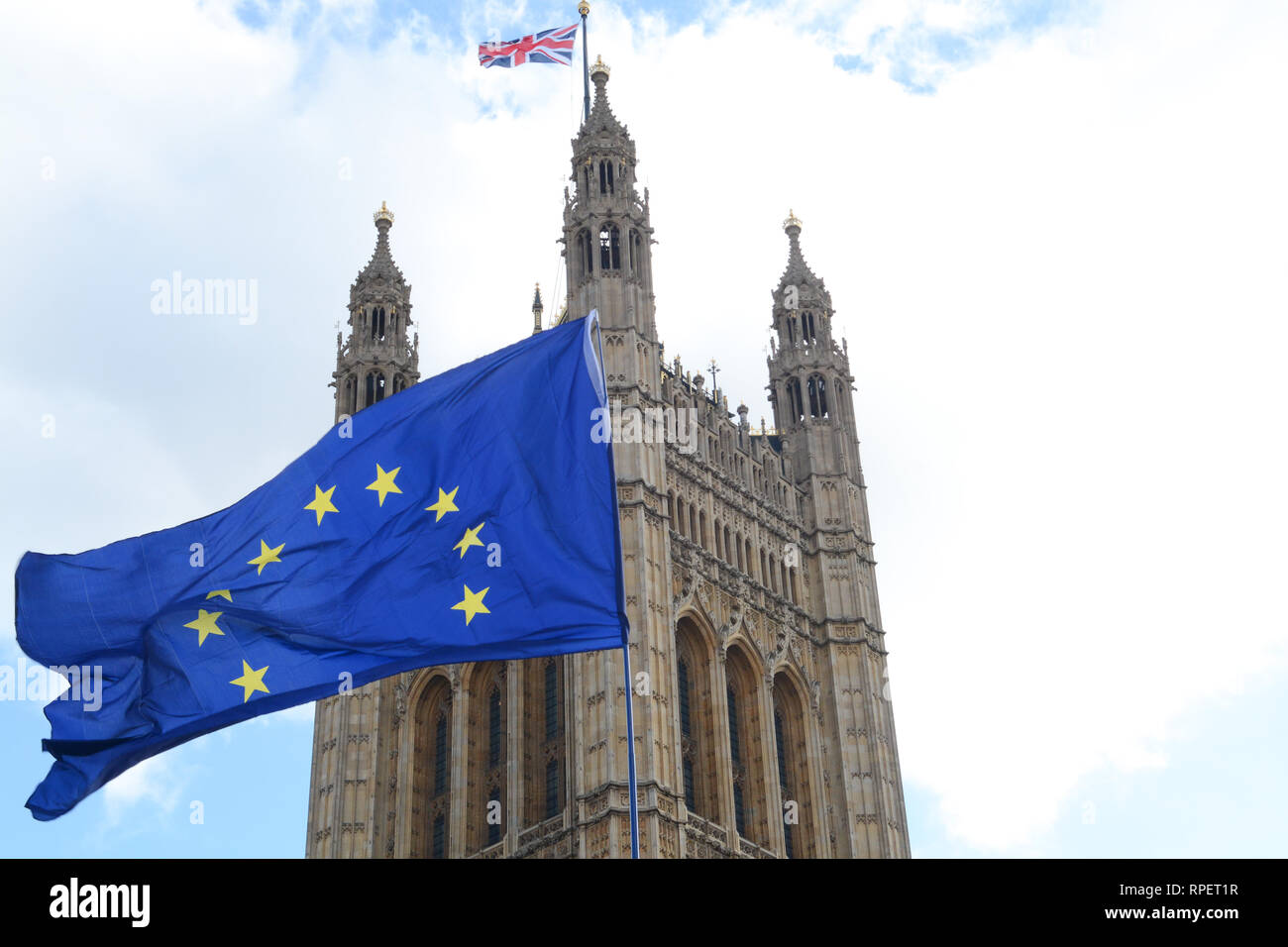E.U. Flag flying in front of Union ack flag at Houses of Parliament London Stock Photo