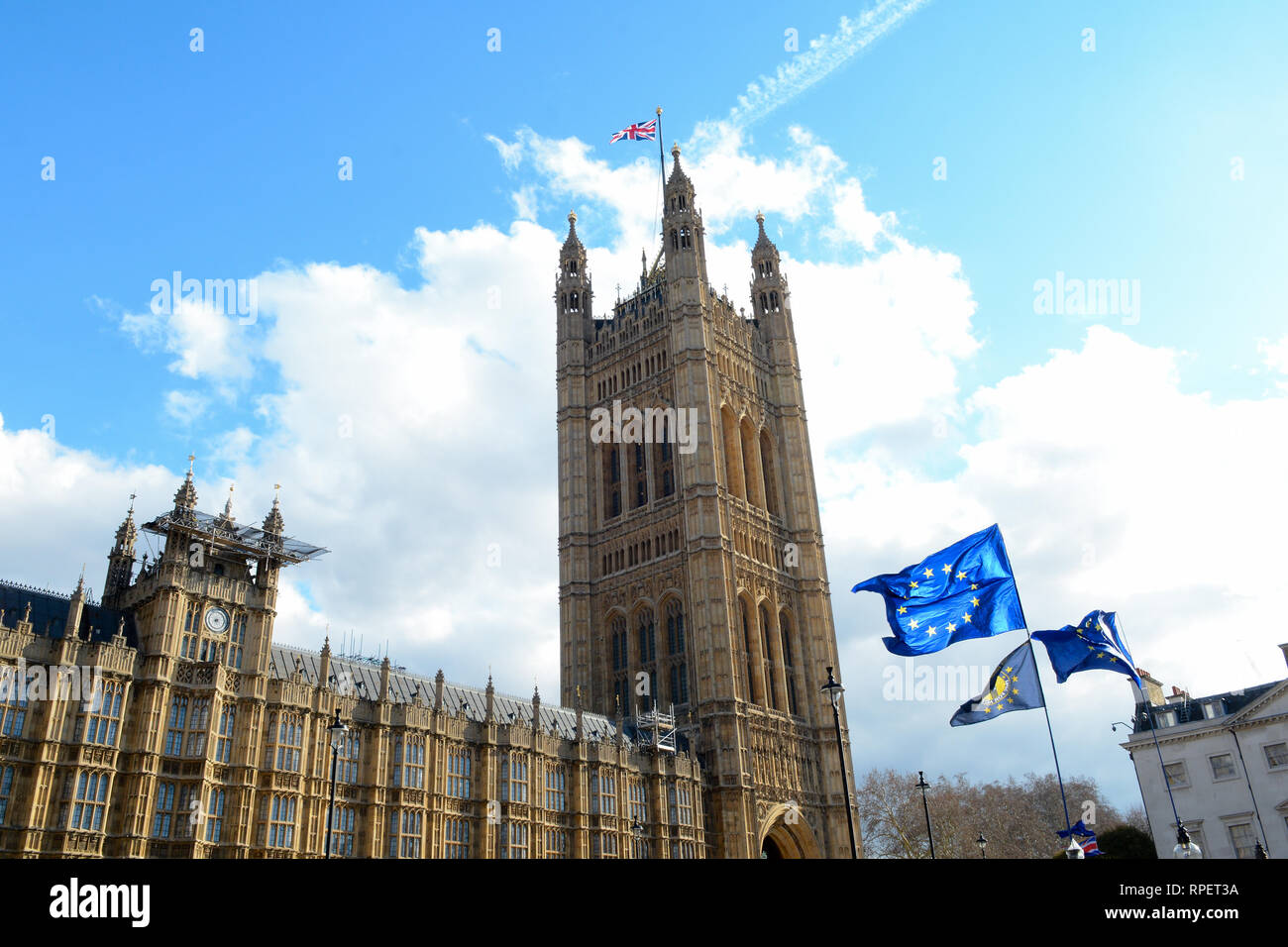 E.U. Flag flying in front of Union ack flag at Houses of Parliament London Stock Photo
