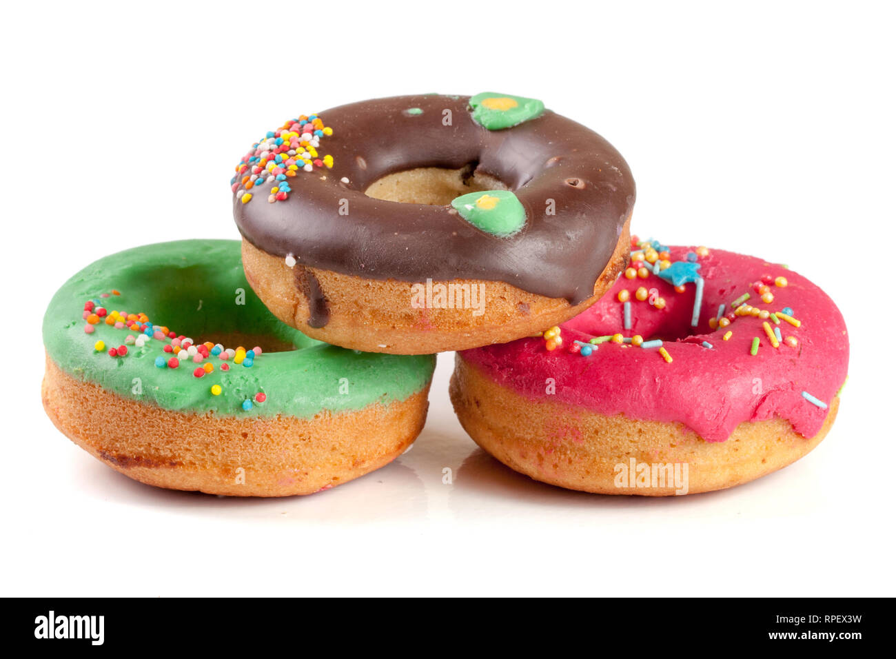 three glazed donut isolated on white background Stock Photo - Alamy