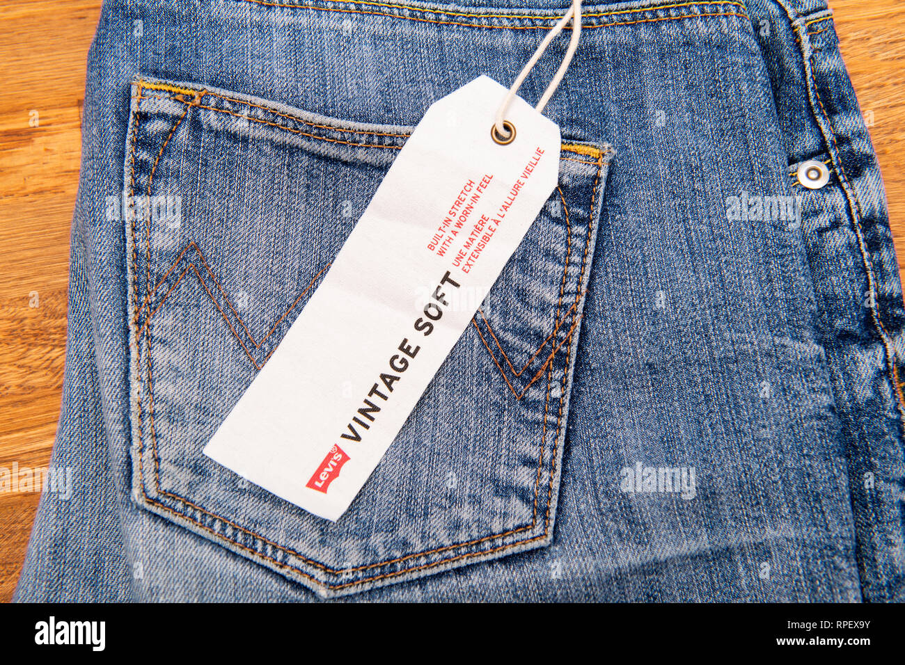 PARIS, FRANCE - JAN 2, 2018: New Jeans with price tag manufactured by the  Levi's placed on natural wooden table - model Vintage Soft Stock Photo -  Alamy