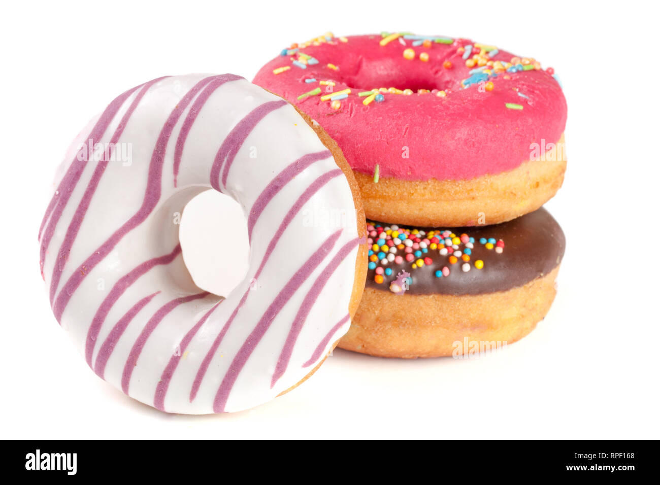three glazed donut isolated on white background Stock Photo - Alamy
