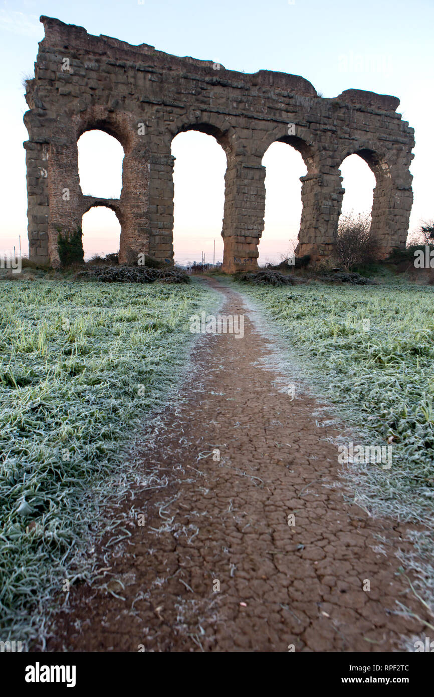 ROME -  Part of an aqueduct in the early morning at the Parco degli Acquedotti. Stock Photo