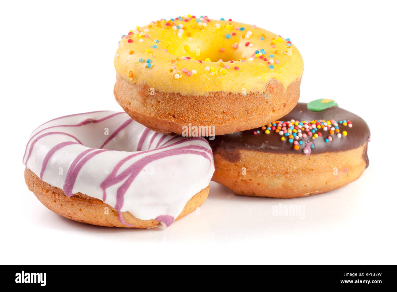 three glazed donut isolated on white background Stock Photo - Alamy