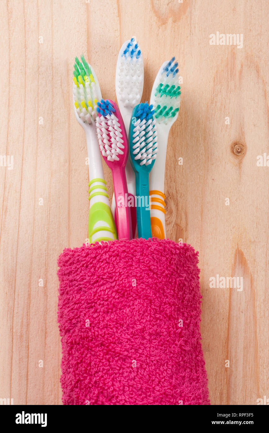 toothbrushes on the light wooden background Stock Photo - Alamy