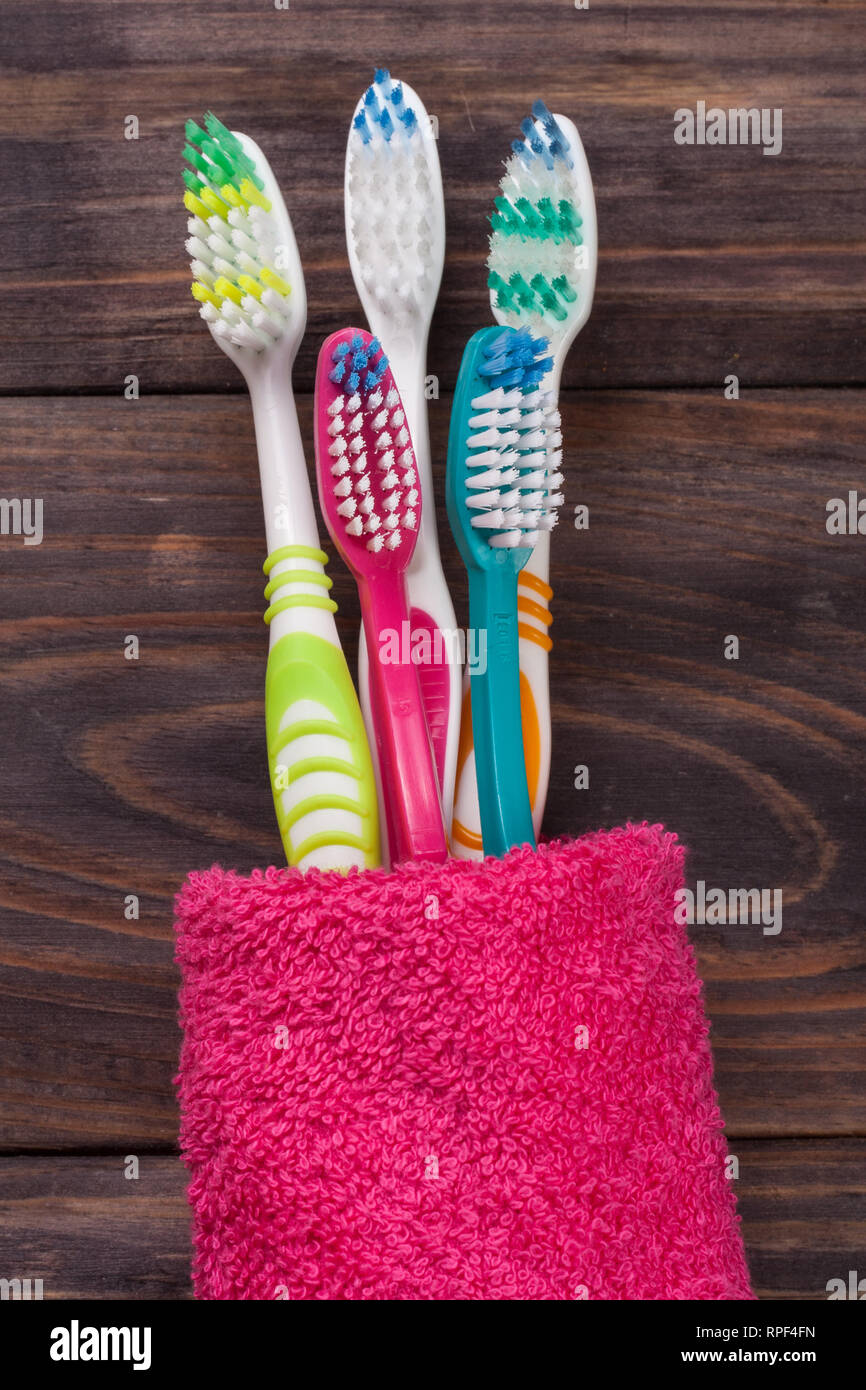 toothbrushes on the black wooden background Stock Photo - Alamy