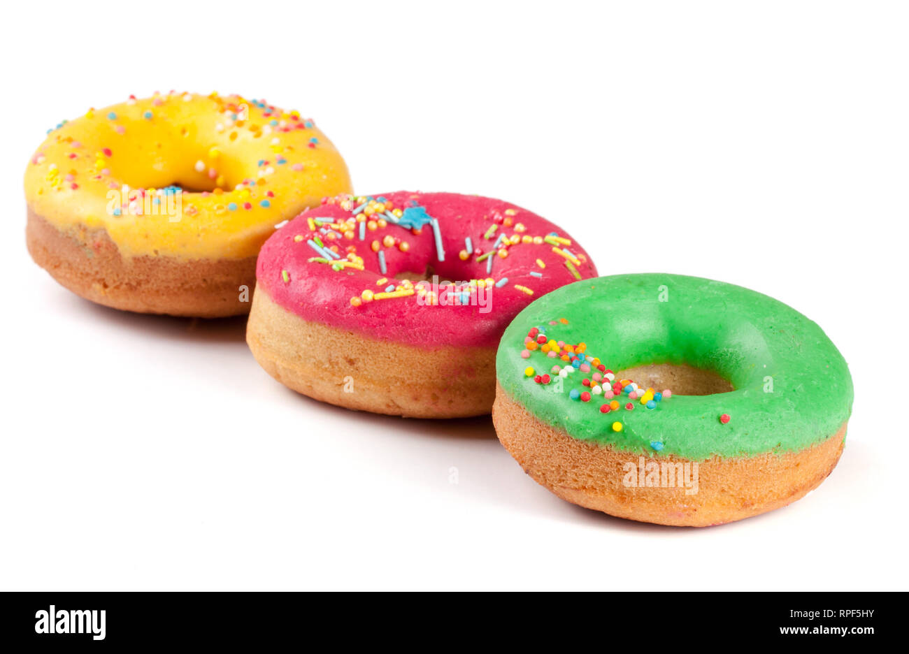 three glazed donut isolated on white background Stock Photo - Alamy