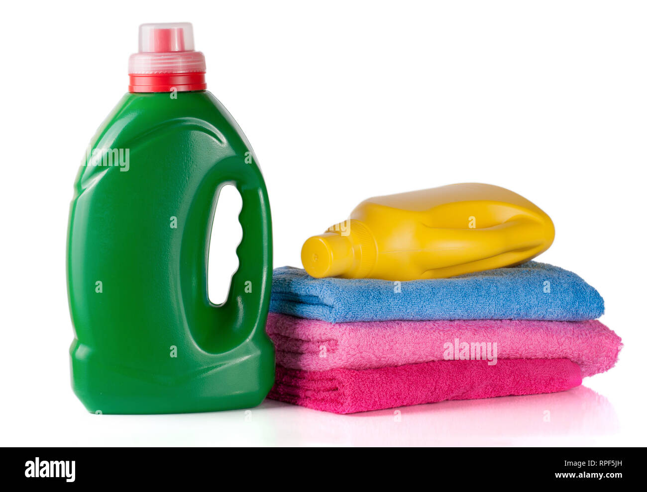 bottle laundry detergent and conditioner or fabric softener with towels