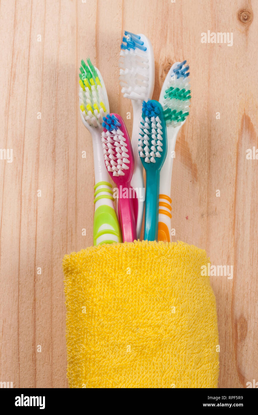 toothbrushes on the light wooden background Stock Photo - Alamy