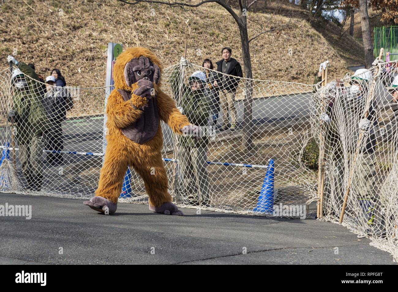 Tokyo, Japan. 22nd Feb, 2019. A zookeeper wearing orangutan
