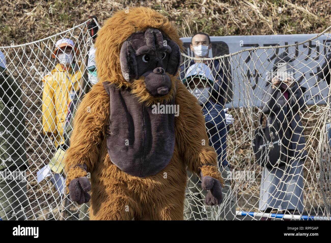 Tokyo, Japan. 22nd Feb, 2019. A zookeeper wearing orangutan costume tries  to escape while zookeepers hold up a net in an attempt to capture it during  an Escaped Animal Drill at Tama