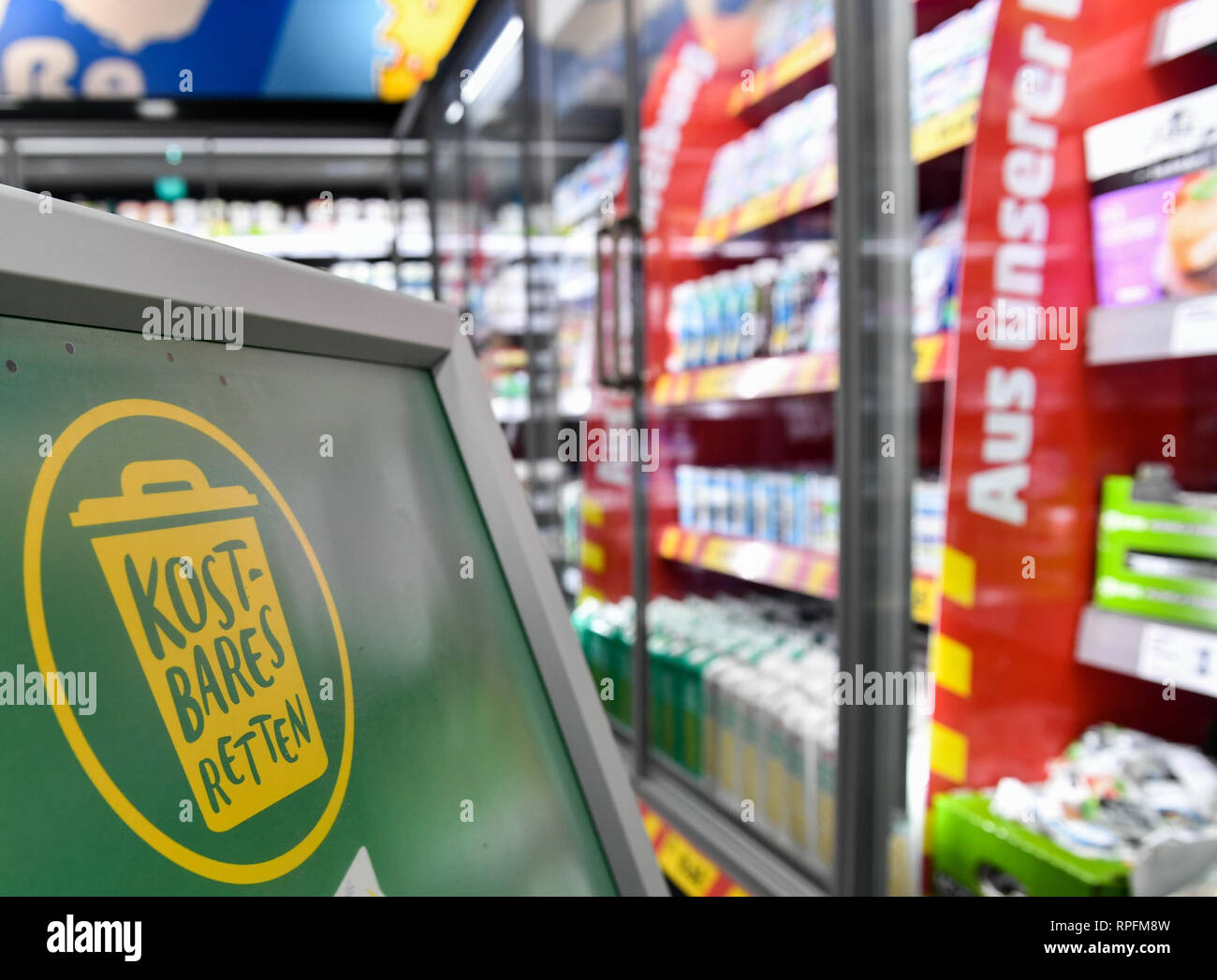22 February 2019, Berlin: A display with the logo "Kostbares retten" stands  for the start of a Germany-wide campaign in the food discounter Penny in Boxhagener  Straße in Friedrichshain. The aim of
