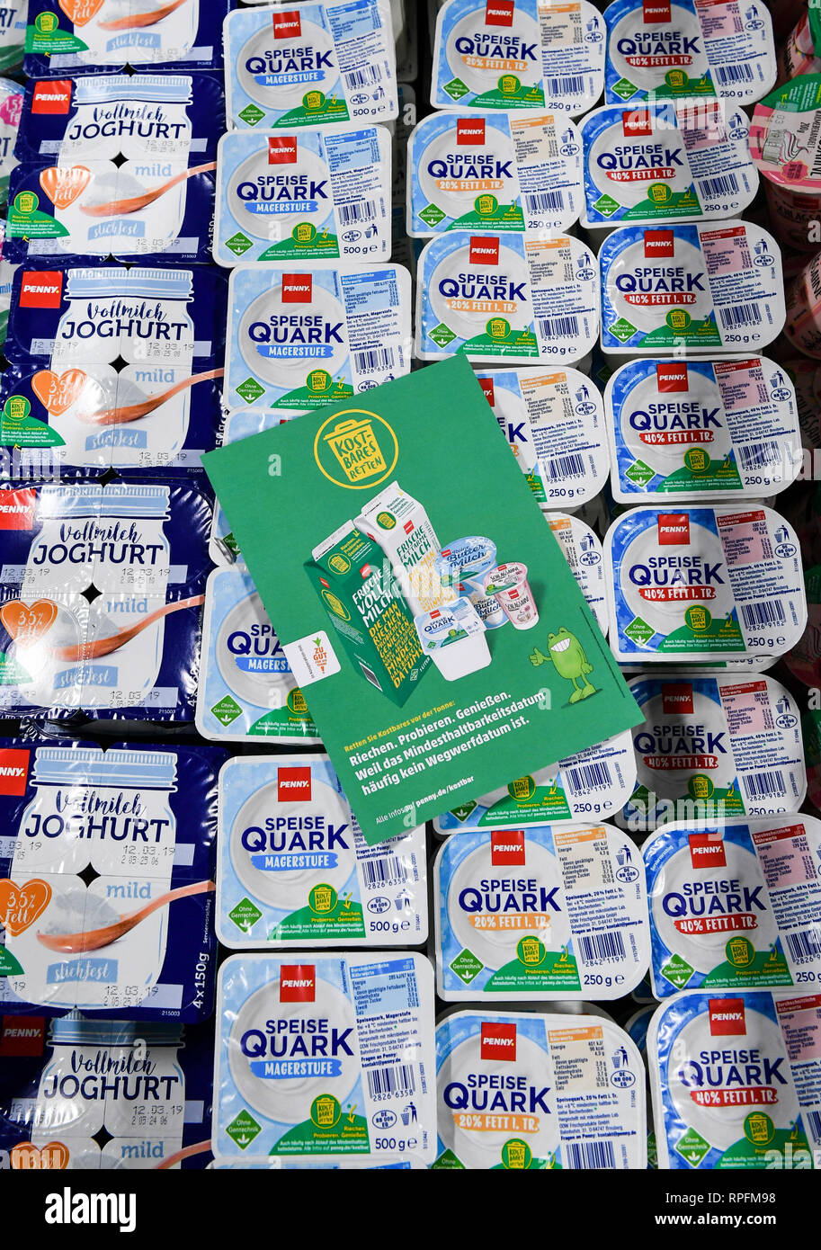 22 February 2019, Berlin: A flyer of the campaign 'Save precious things' is on milk products in a freezer cabinet in the grocery discounter Penny. The nationwide campaign, which aims to reduce food waste, was launched today. The minimum shelf life date is often understood as a disposable date, but many products can be enjoyed for even longer. Photo: Jens Kalaene/dpa Stock Photo