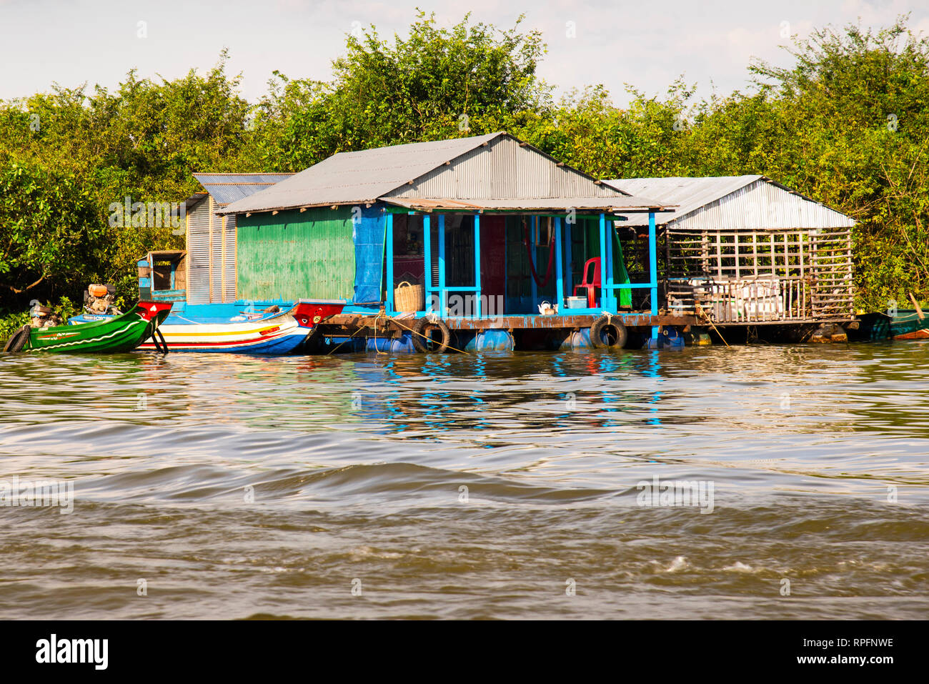 Floating village in Cambodia on the Tonie Sap Lake, a Vietnamese waterborne community of people without a country. Stock Photo