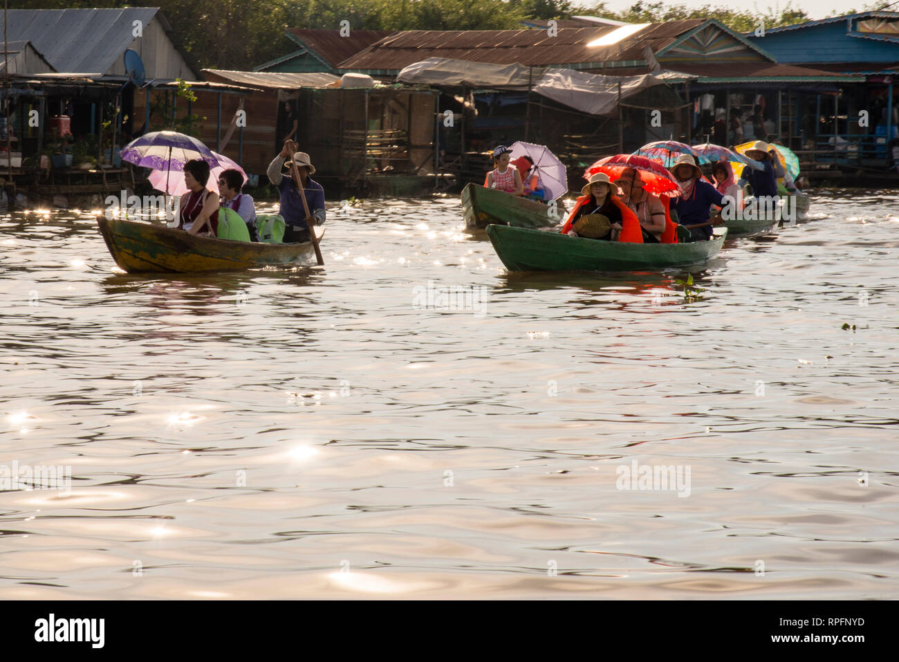 Floating villages and floating tourism on Tonle Sap Lake, Cambodia, home to a water born village of Vietnamese Cambodian immigrants. Stock Photo