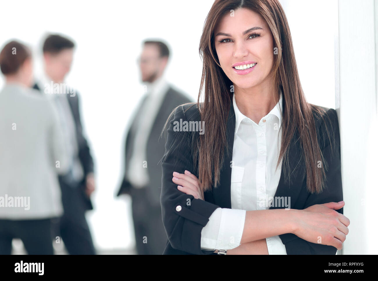 young business woman on blurred office background. Stock Photo