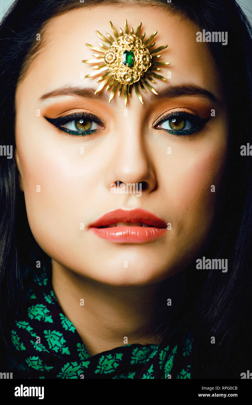 beauty eastern real muslim woman with jewelry close up, bride with star 