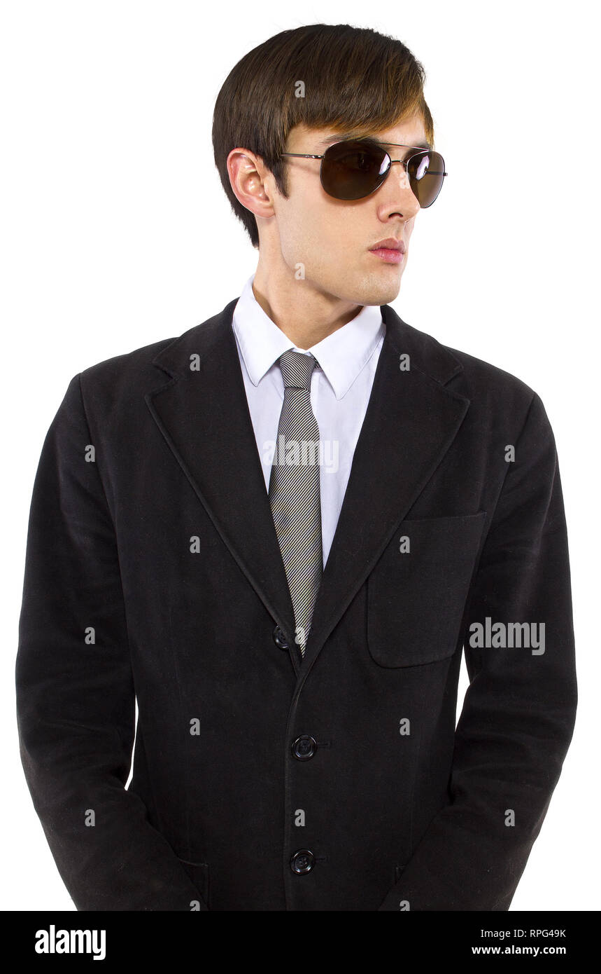 Caucasian male bodyguard wearing sunglasses and black suit Stock Photo