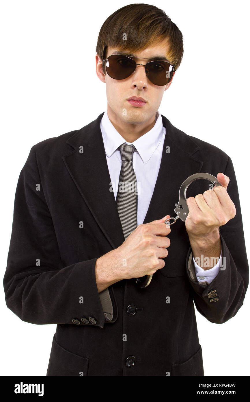 Caucasian male bodyguard wearing sunglasses and black suit Stock Photo