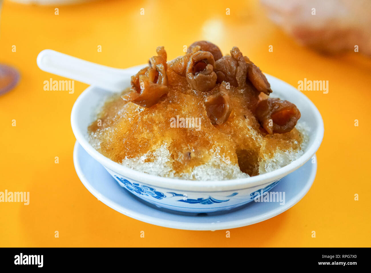 Dried longan fruit on shave ice, a famous dessert from malaysia. -image Stock Photo