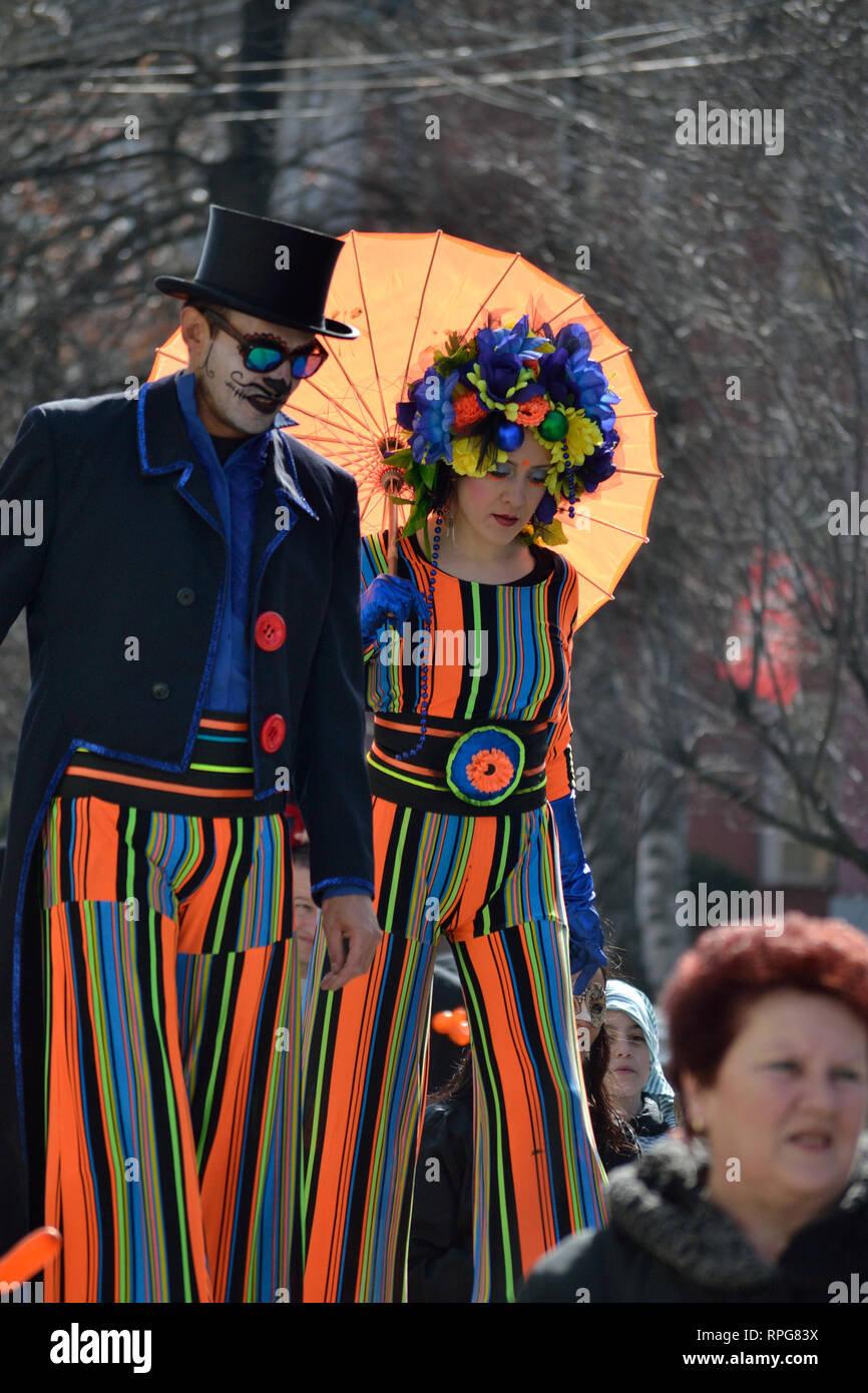 Carnival entertainment couple walking on stilts, Svilajnac, Serbia, Europe Stock Photo