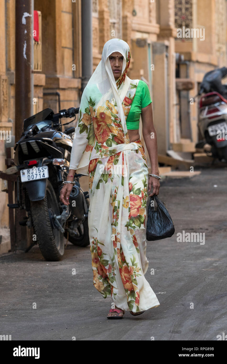 Woman in traditional clothing walking in street, Jaisalmer Fort