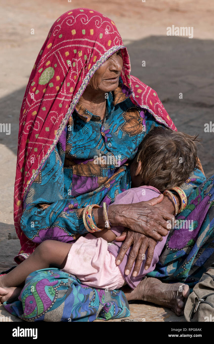 Indian woman carrying baby on hi-res stock photography and images - Alamy