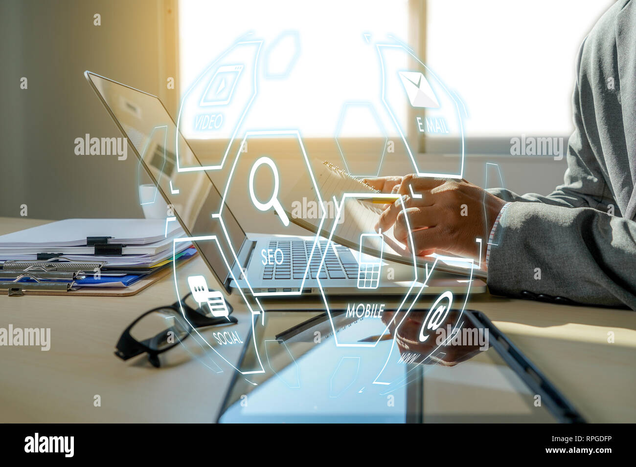 Man using  tablet computer  virtual interface graphic icons network diagram Digital marketing Stock Photo