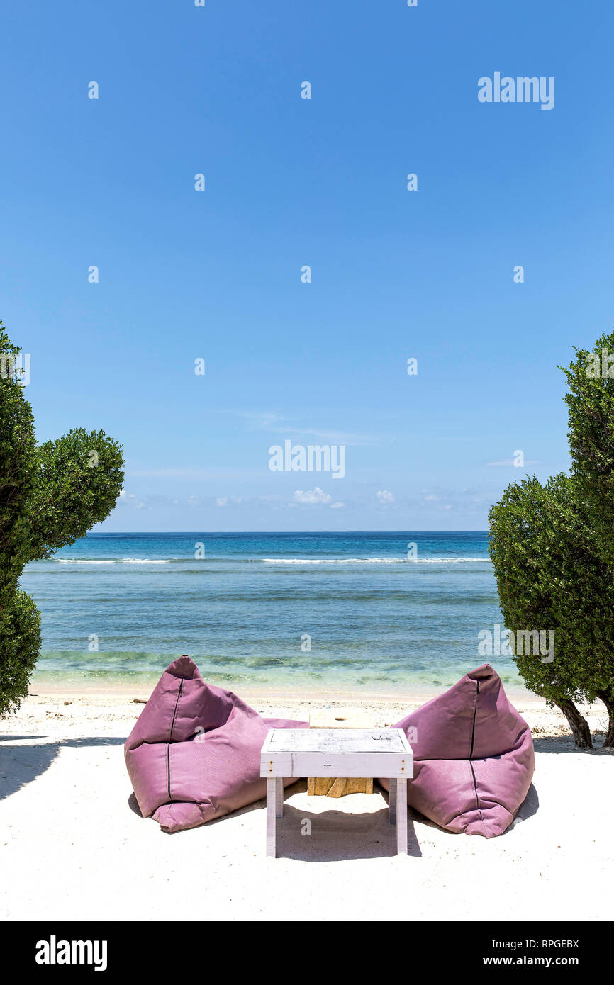 Colorful sunbeds on the beach of Gili Trawangan island, Indonesia. Stock Photo