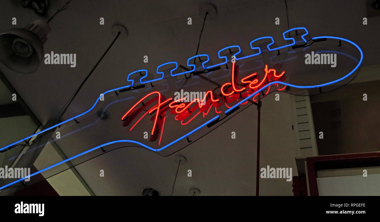 Fender Neon Sign in a music instruments store, in blue and red Stock Photo