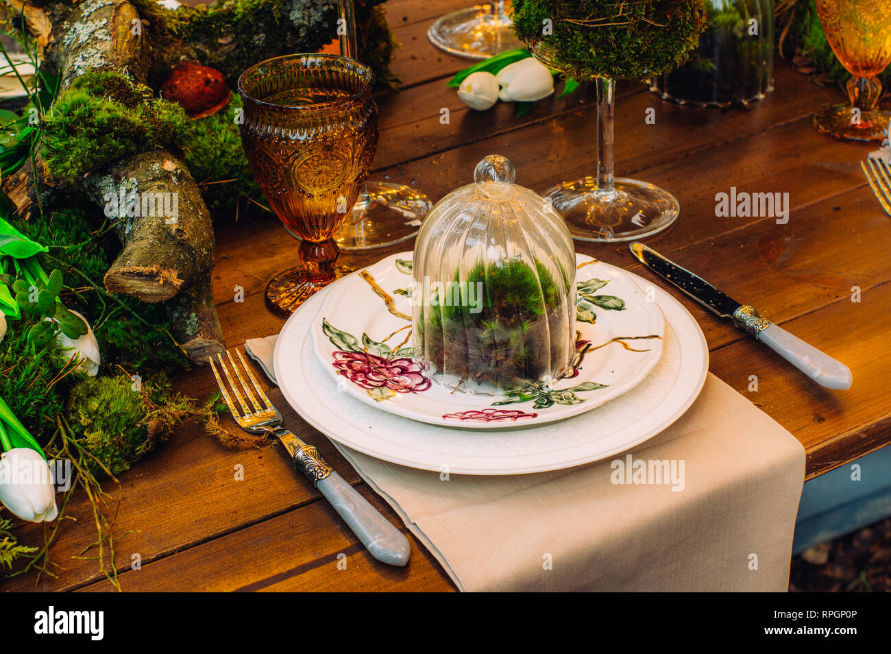 Wedding Table Decorations With Tulips And Moss Stock Photo