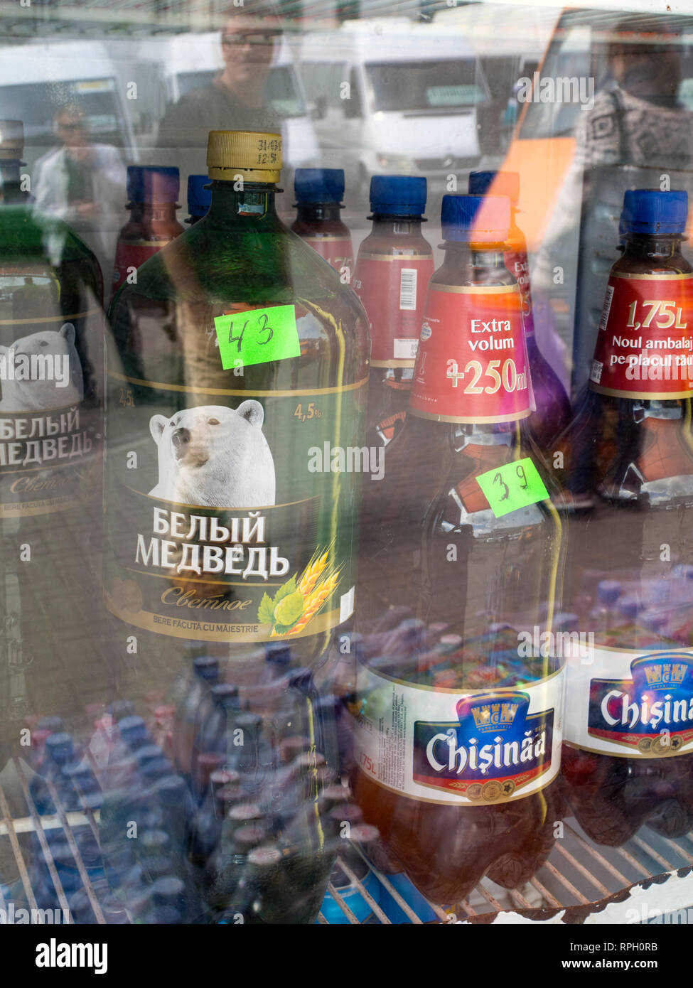 Cheap 2-litre bottles of beer in a fridge in Chisinau, Moldova Stock Photo