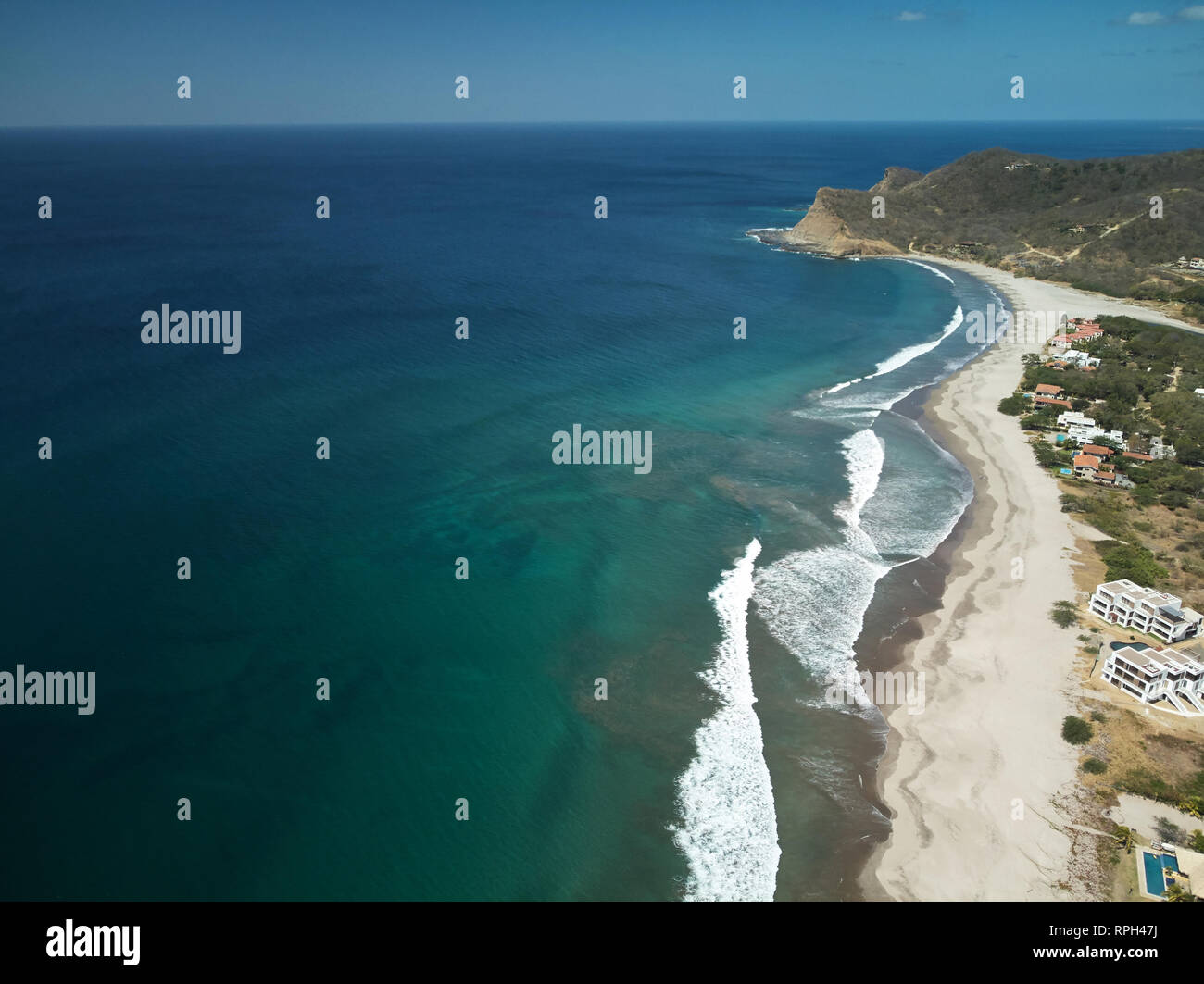 Houses on beachfront aerial drone view with copy space Stock Photo