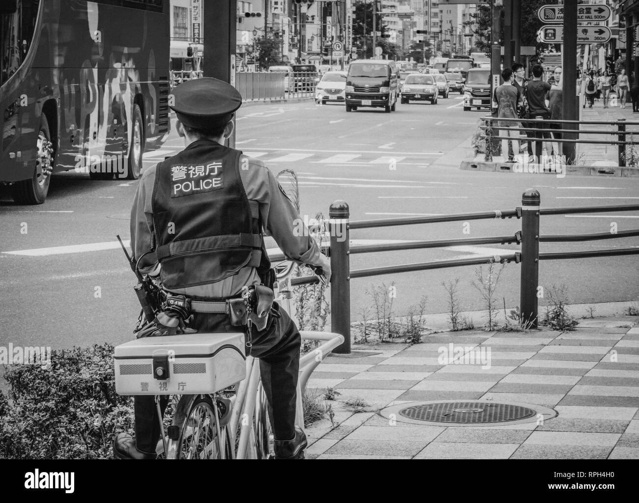 Japanese police officer in tokyo Black and White Stock